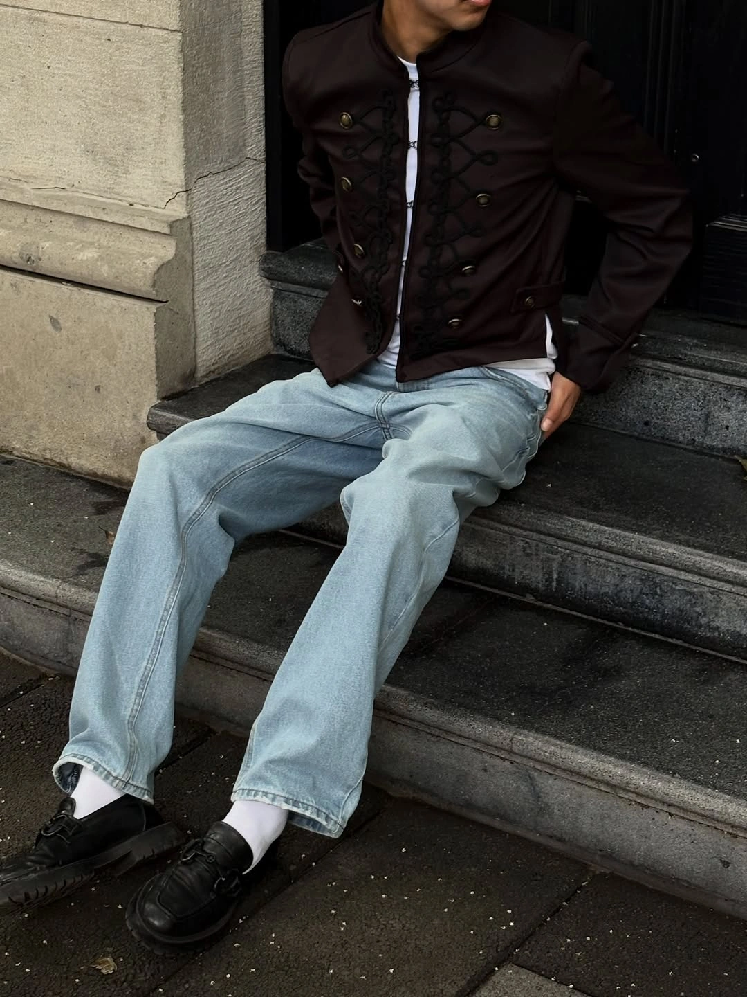 Black hoodie black wide trousers white layered hem and white sneakers