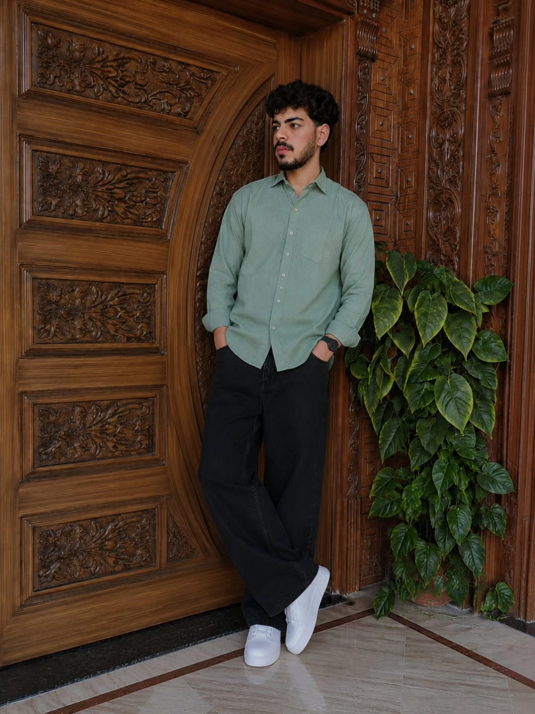 Blue striped shirt olive pleated trousers brown sandals and canvas tote