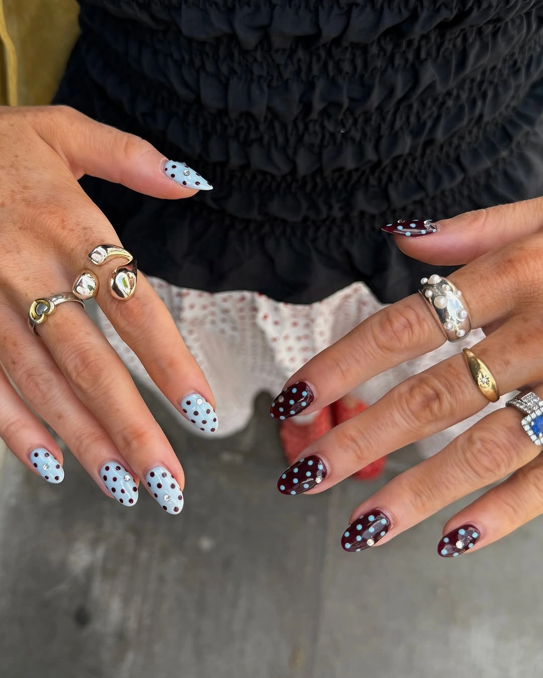 Medium almond nails with blue berry dotted fields and blush nails