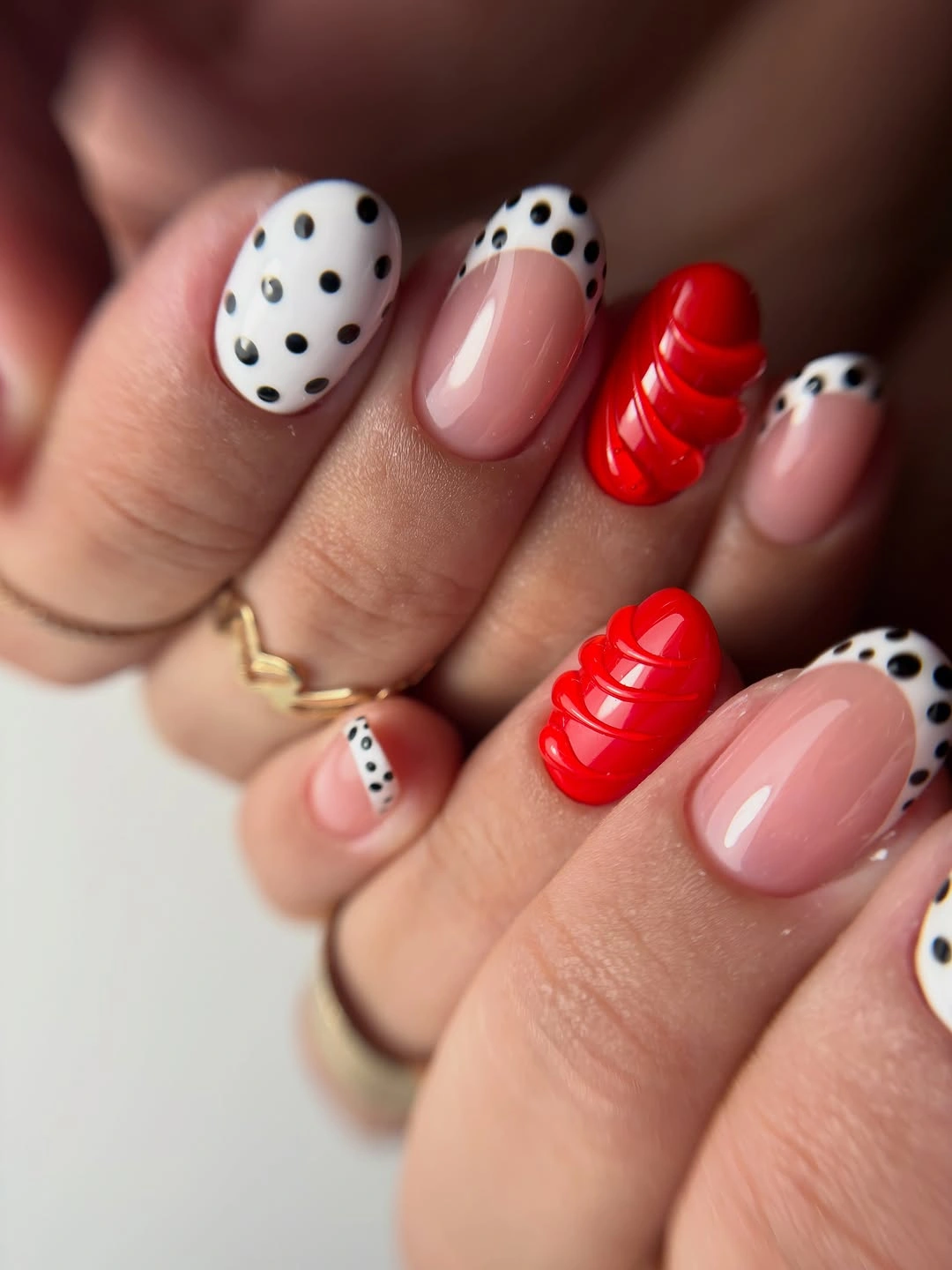 Red white and blush nails with black dots and red accents