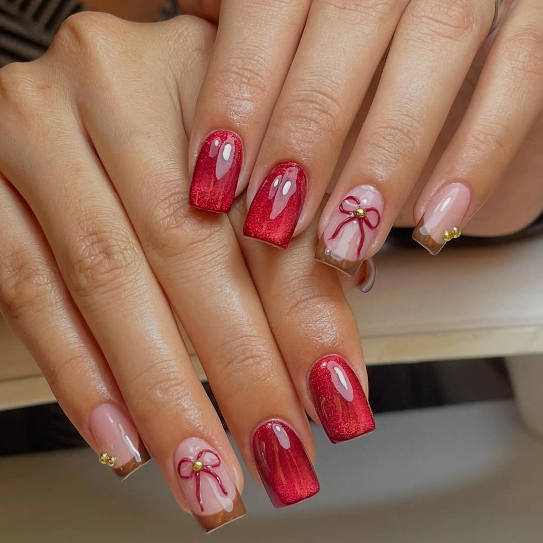 Red glitter square nails with pale pink bows and gold details