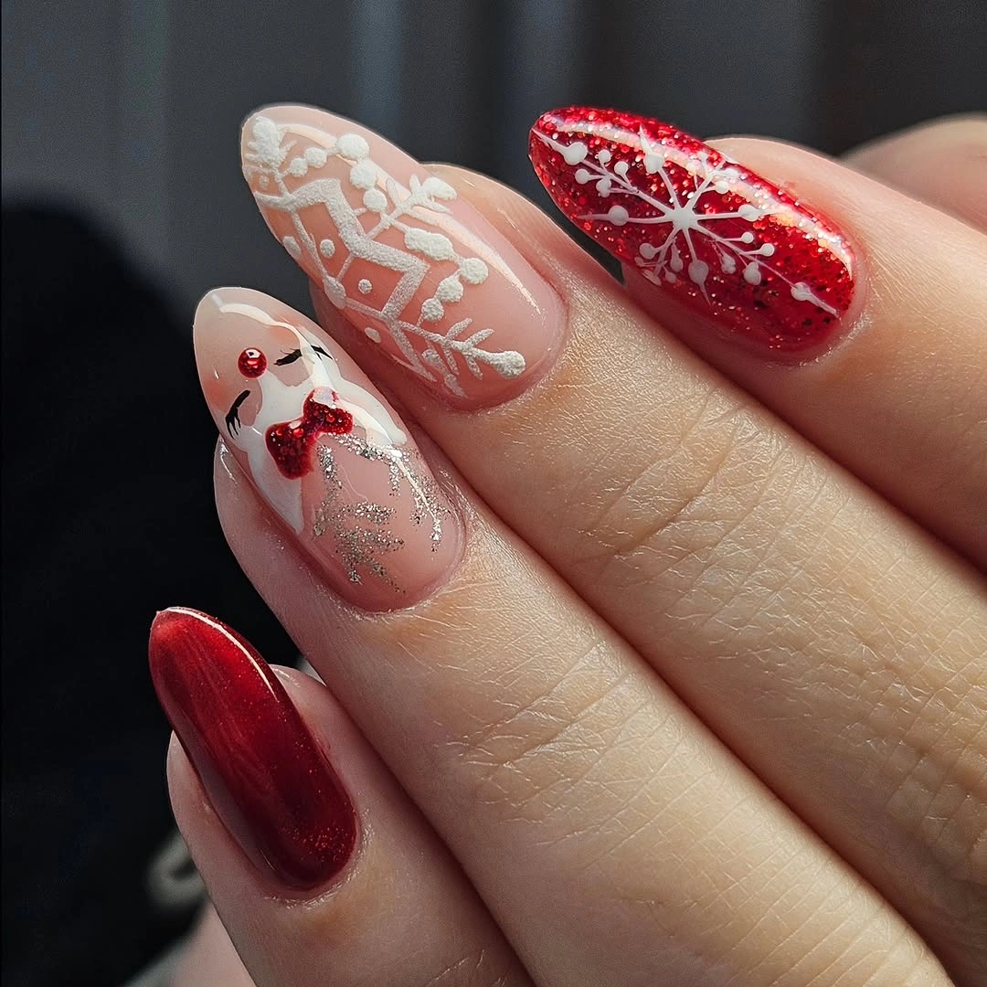 Mixed red pink white and silver nails with winter motifs