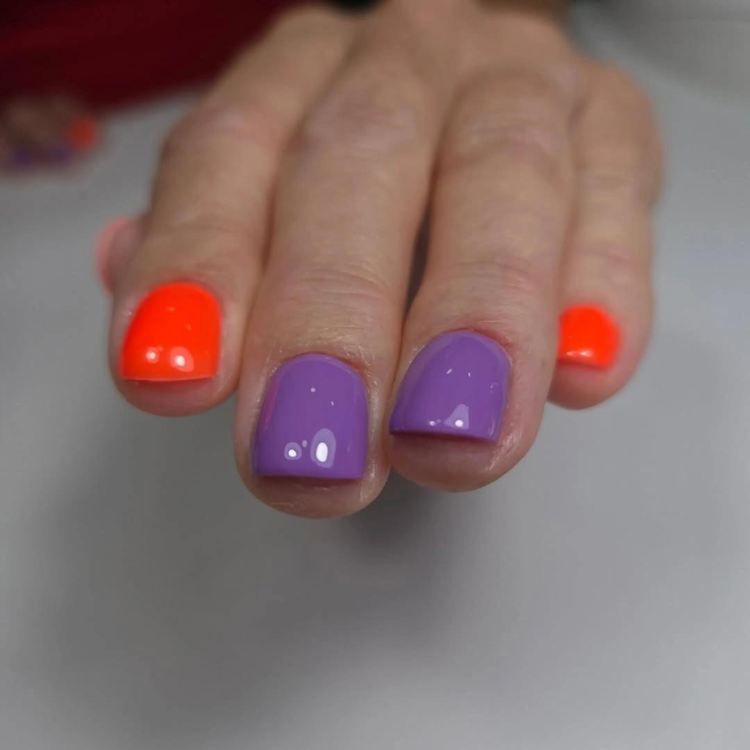 Bright orange and purple short square glossy nails
