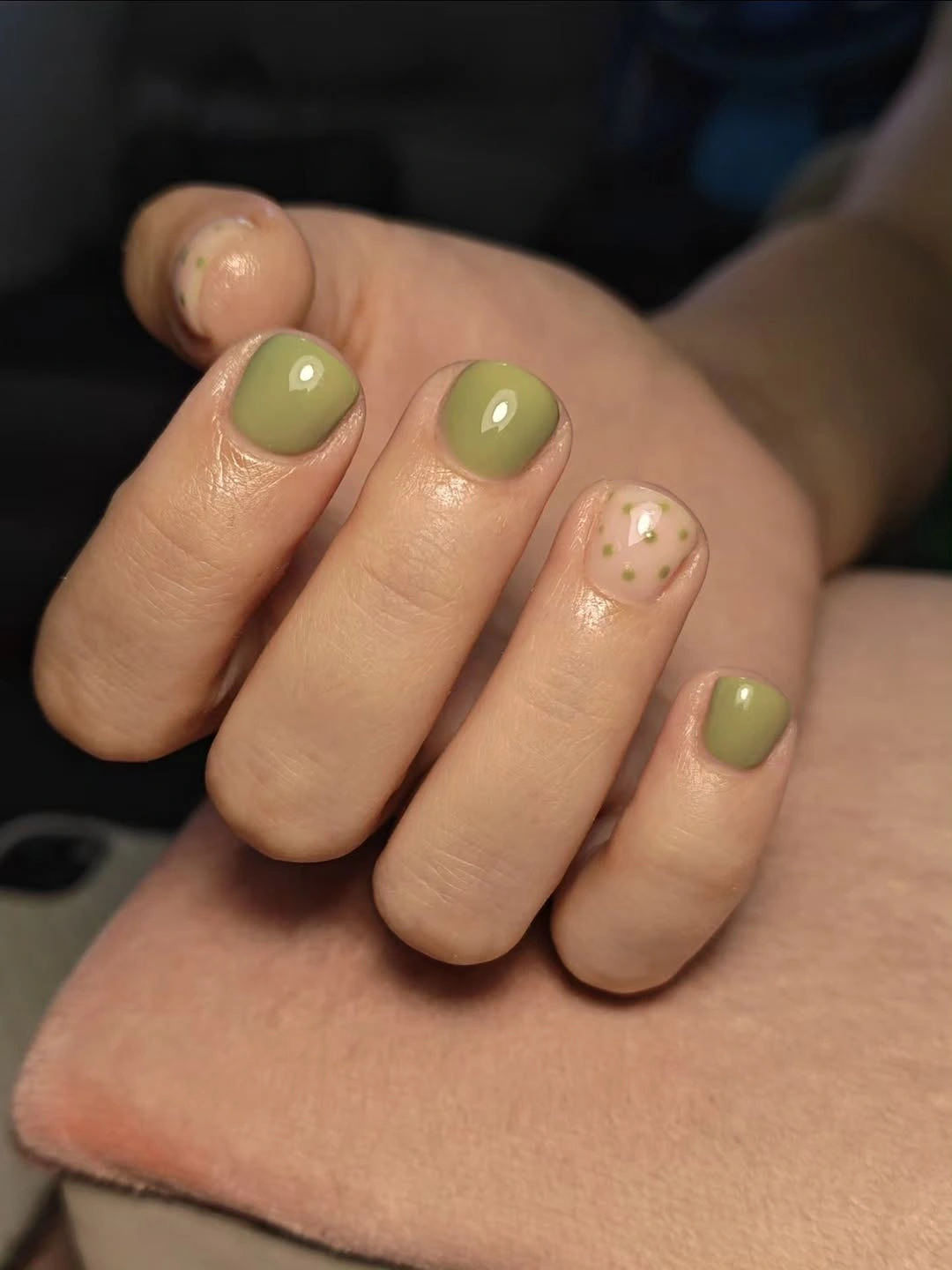 Sage green short nails with sheer gold-toned fleck accents