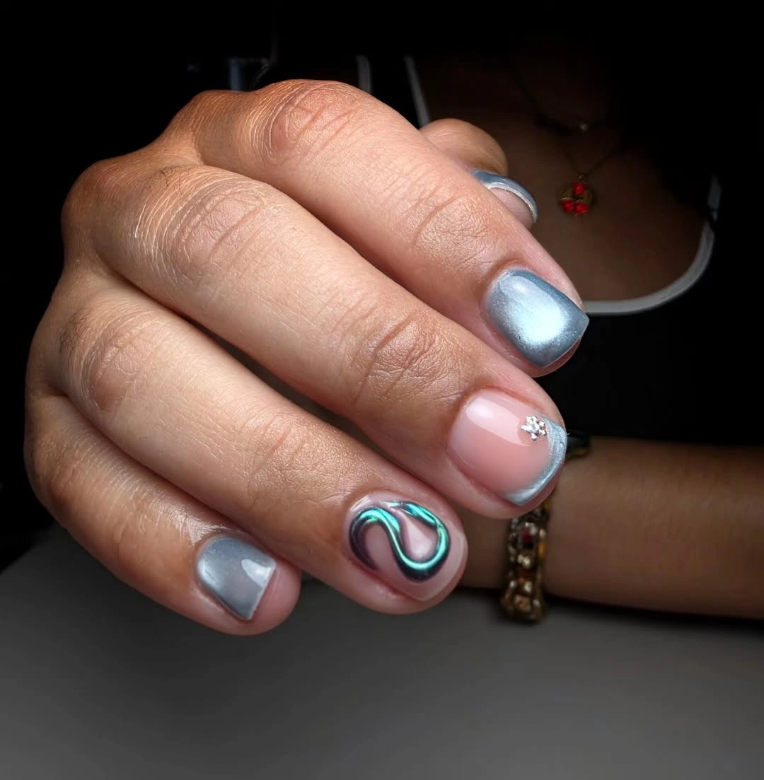 Mixed silver and pale pink short nails with teal swirl accent