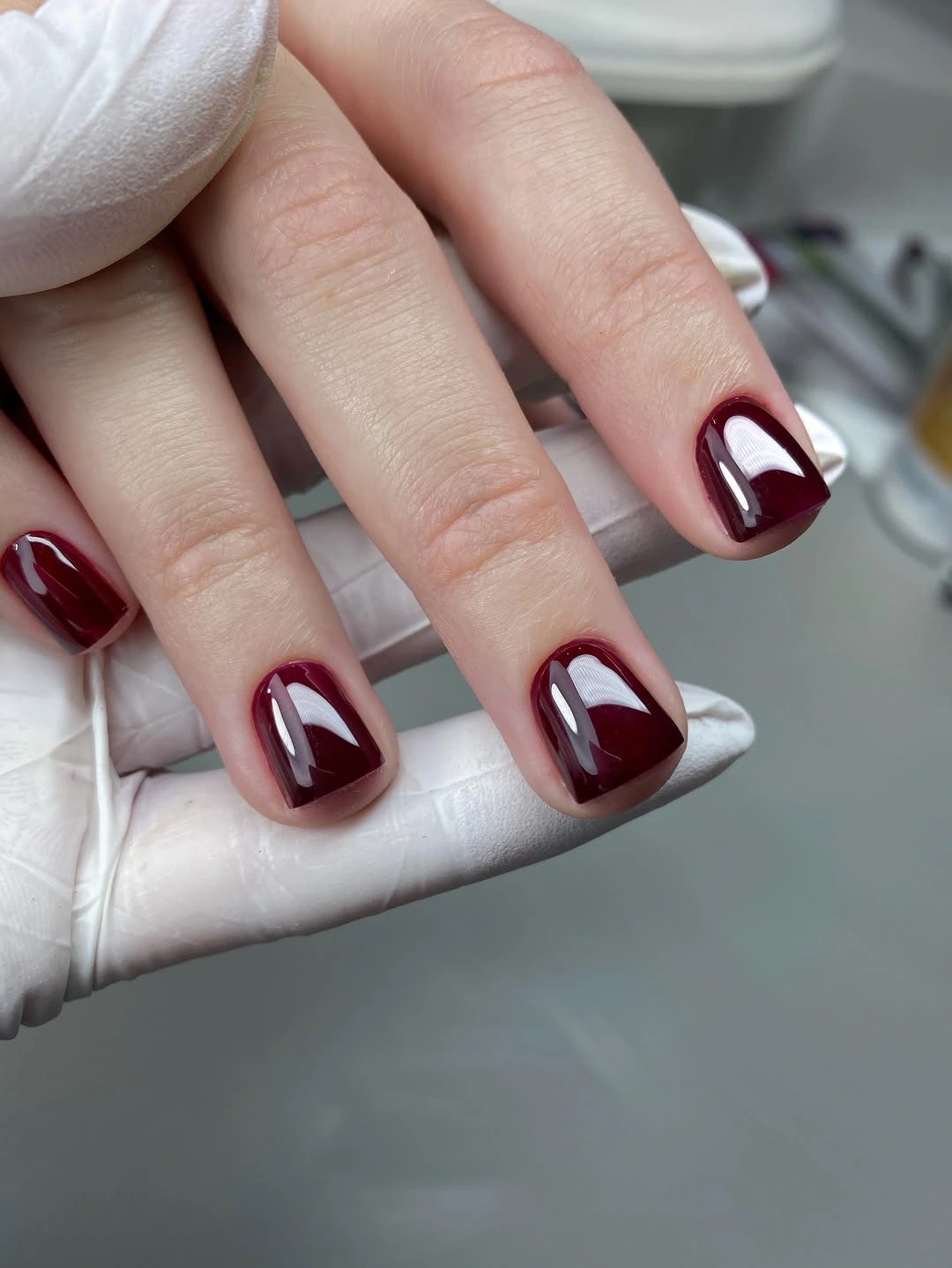 Deep burgundy glossy short square nails