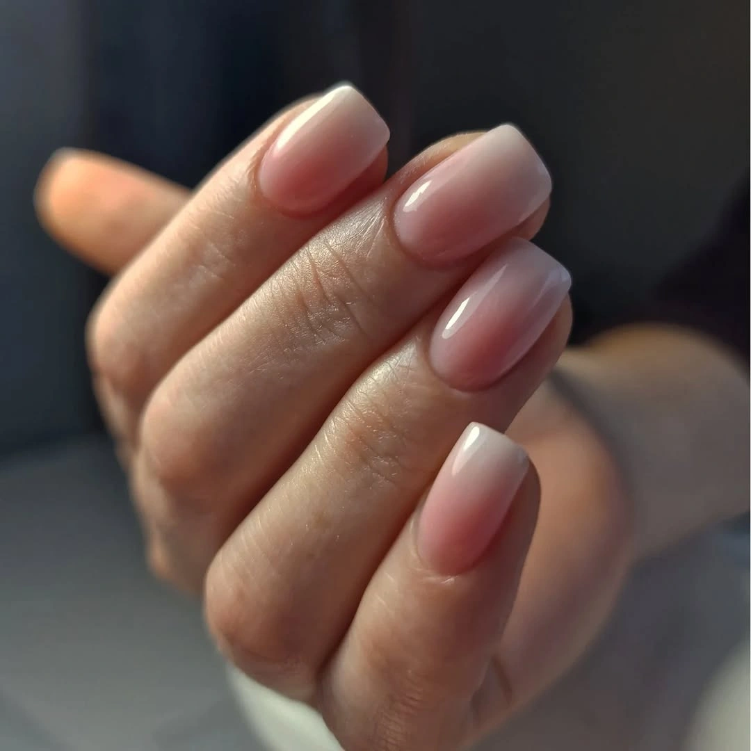 Soft pink short nails with milky pale edges
