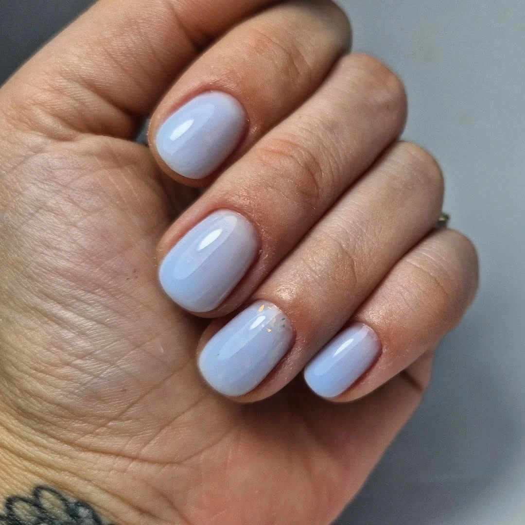 Pale blue gray glossy short nails with rounded shape
