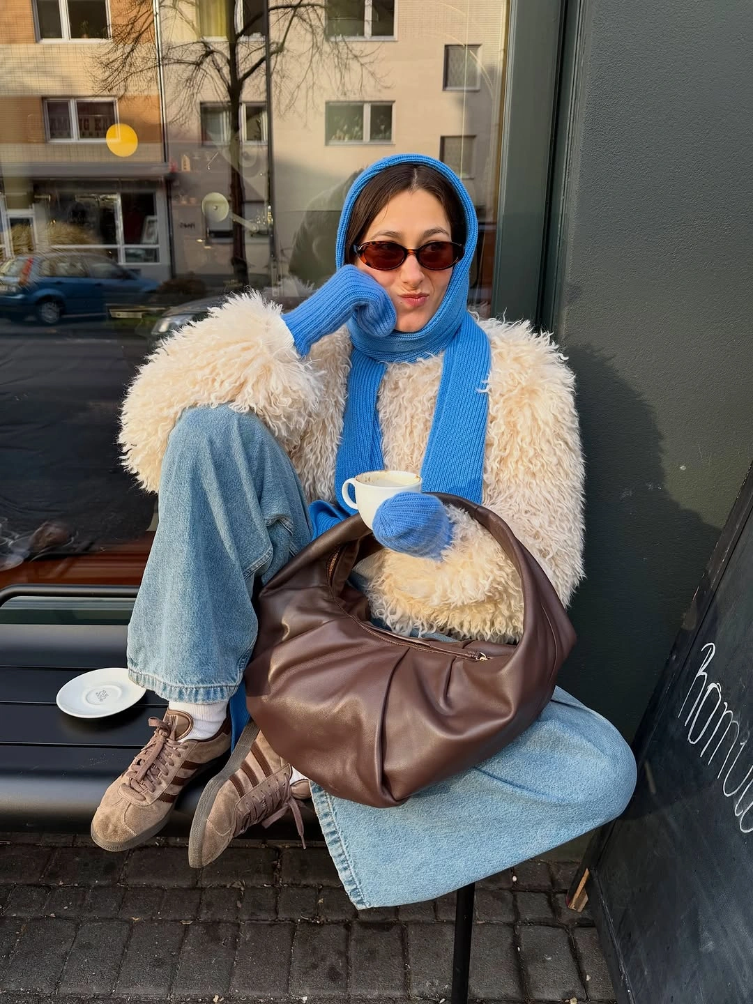 Cream shaggy jacket cobalt scarf wide light jeans brown boots