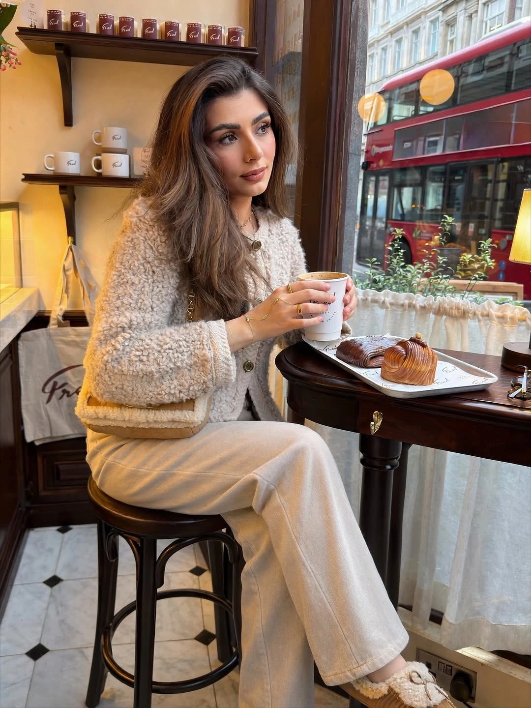 Cream textured cardigan with wide trousers and white trainers