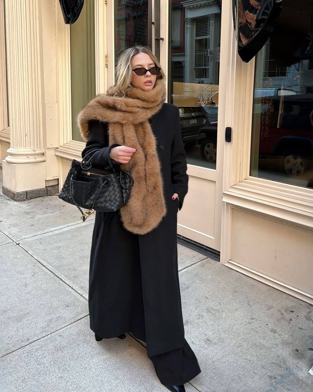 Black long coat with camel scarf and wide trousers