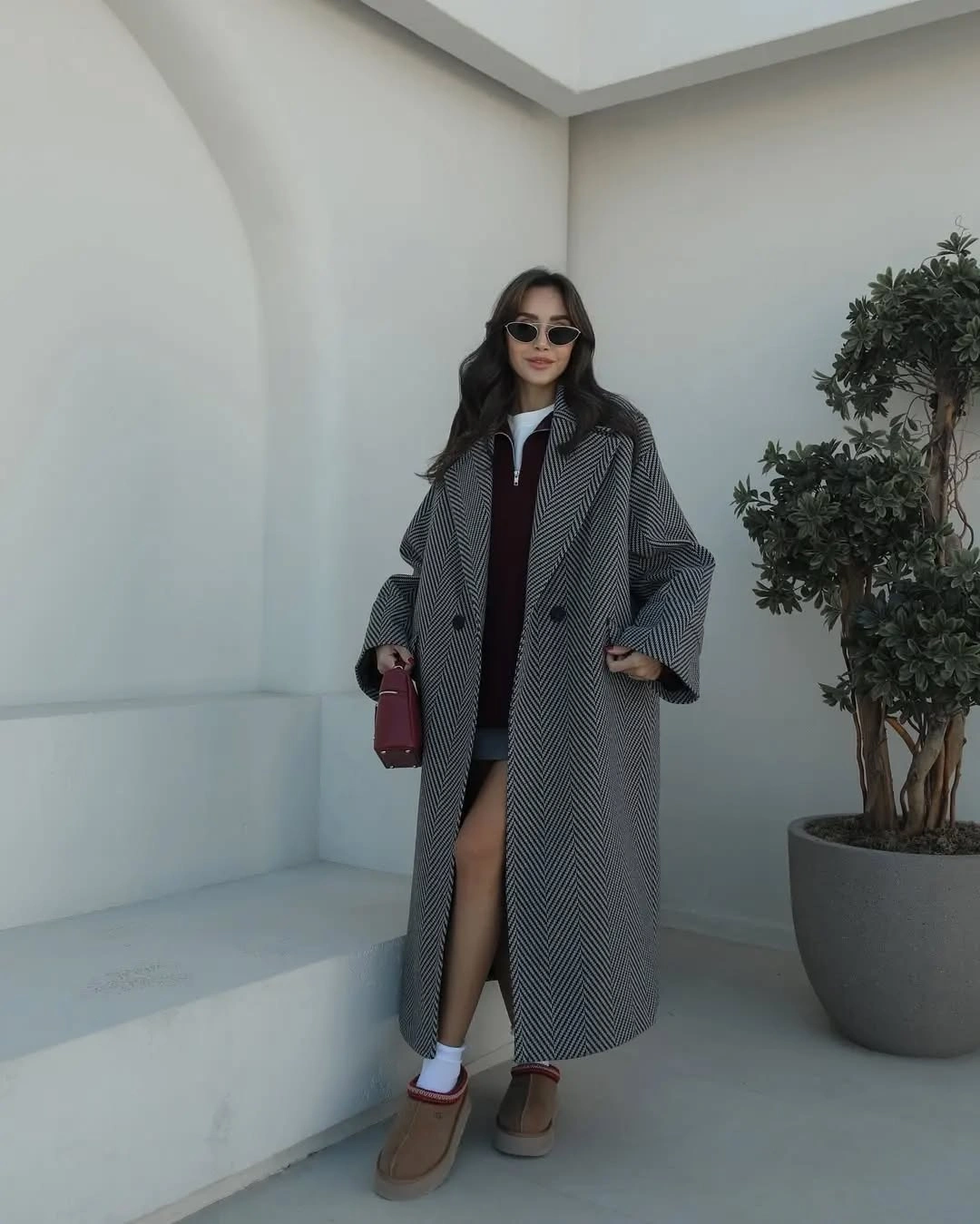 Gray checked long coat over burgundy layer and tan shoes