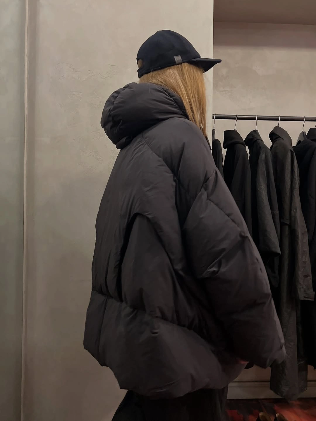 Oversized dark hooded padded jacket with backward cap
