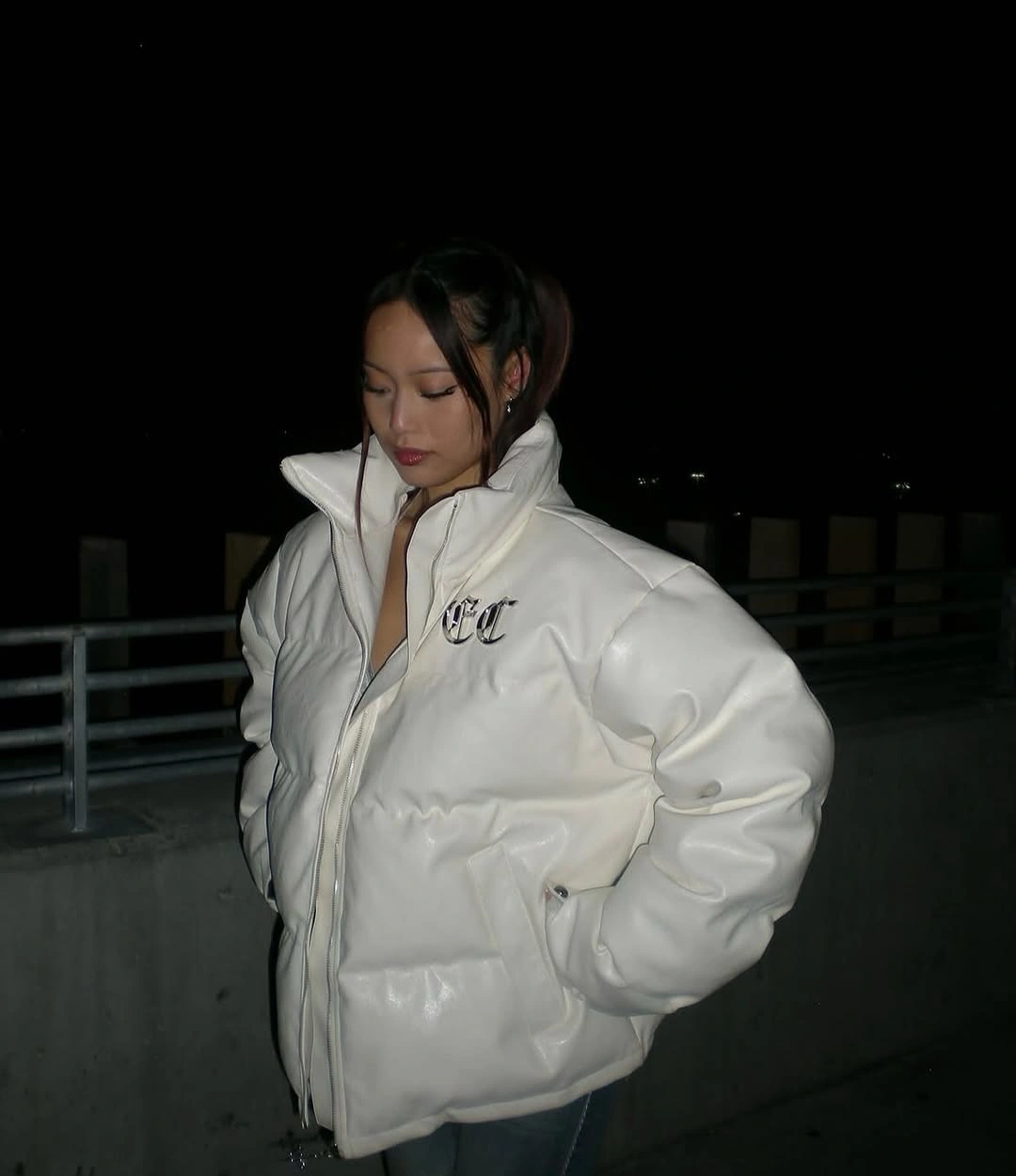 Glossy-looking white padded jacket with high open collar