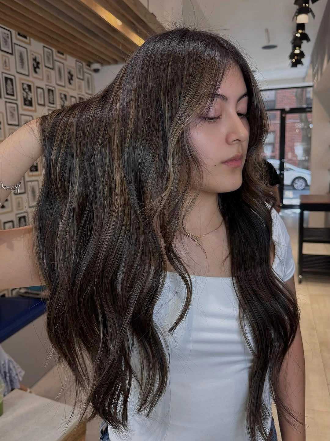 Long dark brunette wavy hair with soft front layers