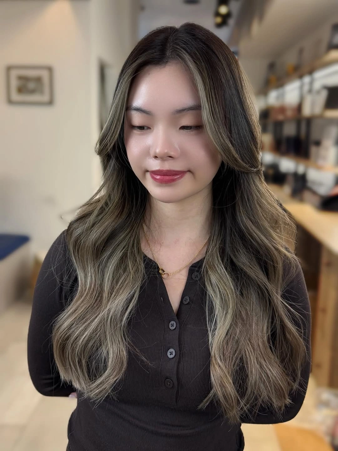 Long brunette hair with ash pieces and curtain bangs
