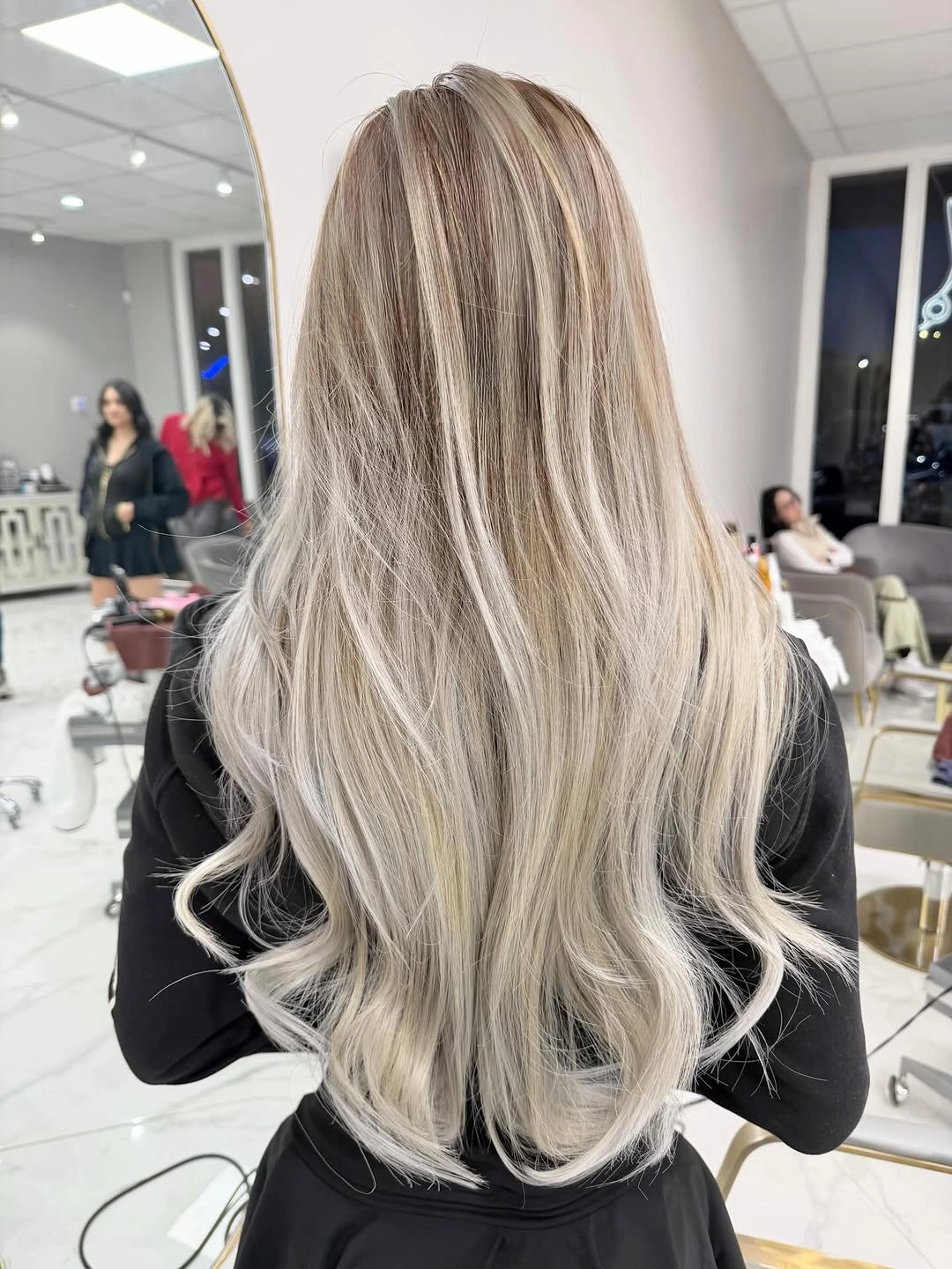 Long very light blonde silver wavy hair from back