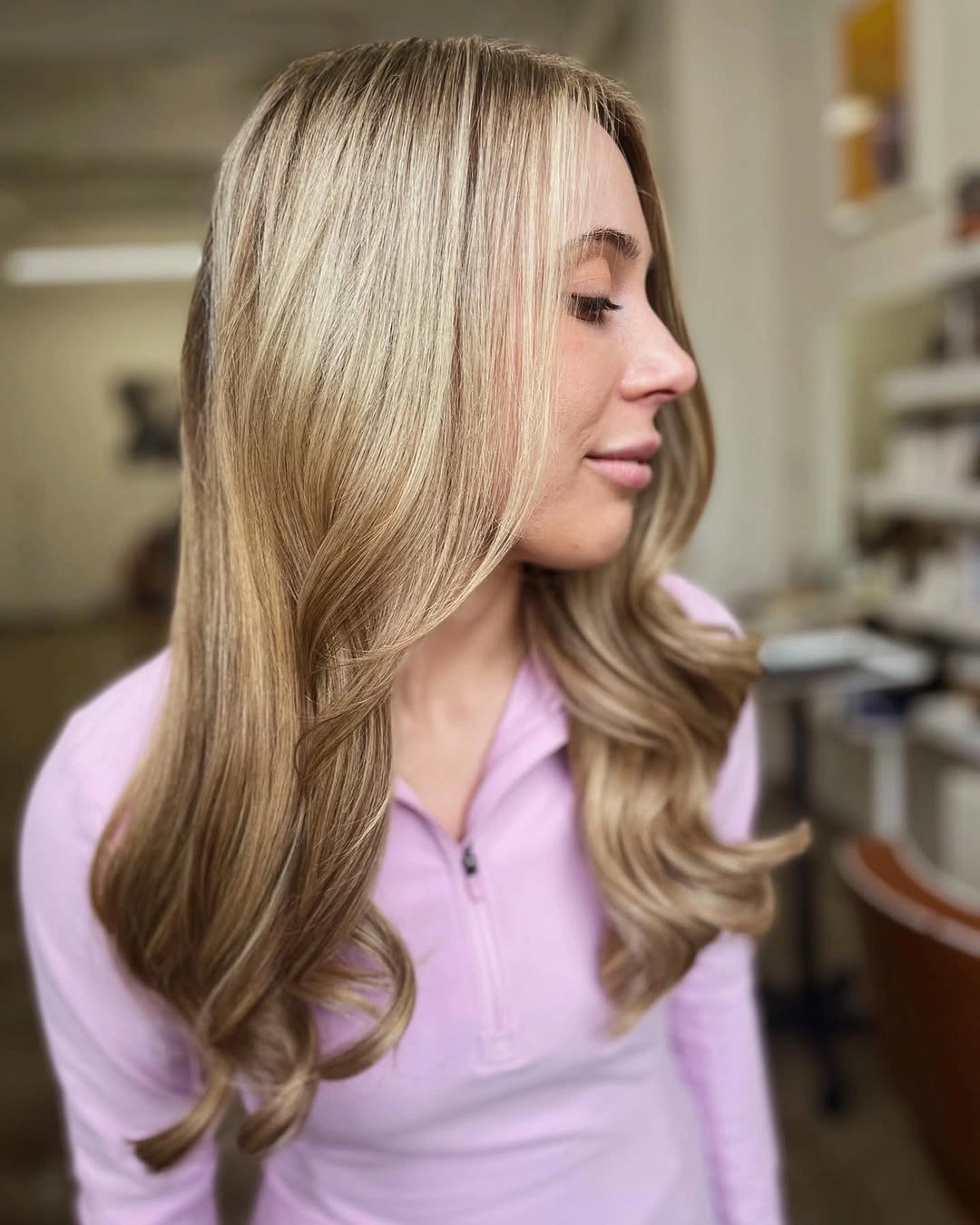 Medium long honey blonde hair with flipped ends