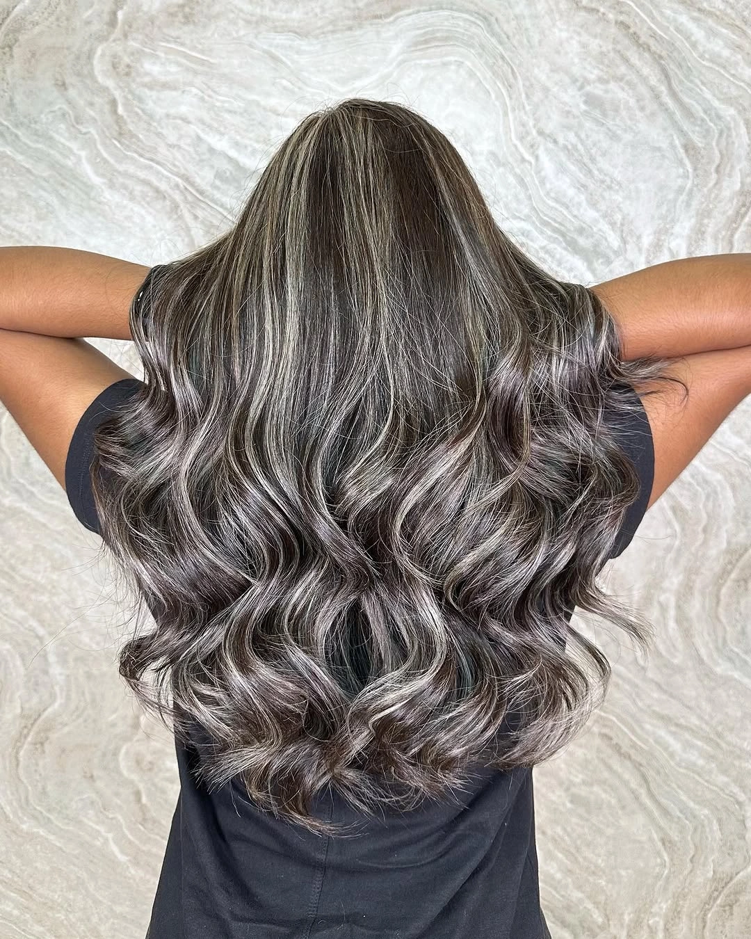 Long cool silver grey wavy layered hair