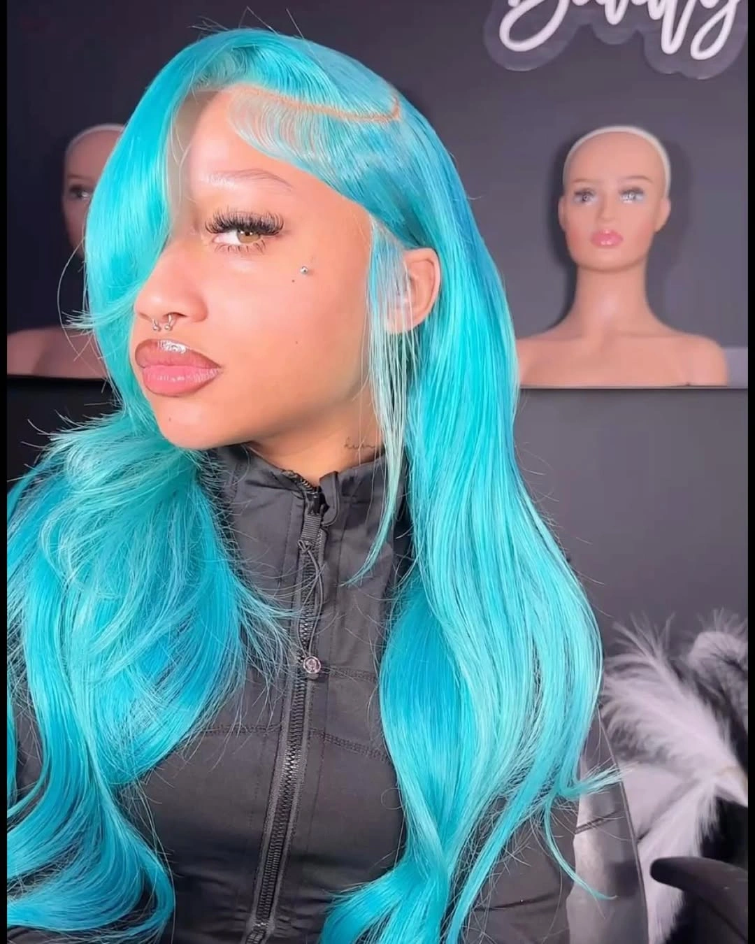 Vivid turquoise long hair with side part and swoop