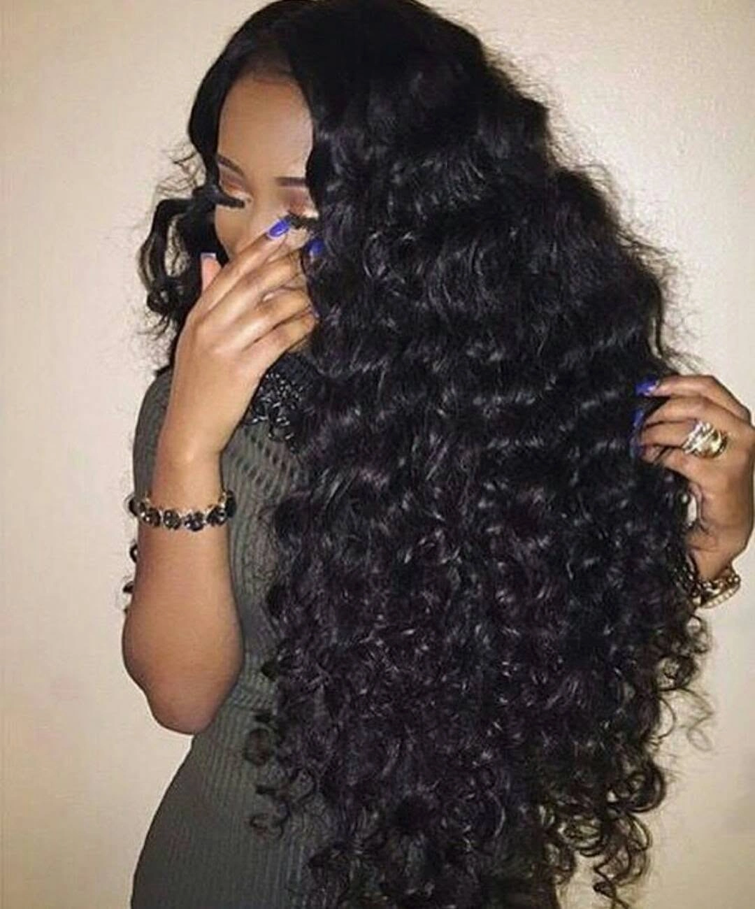 Very long black curls cascading below the shoulders