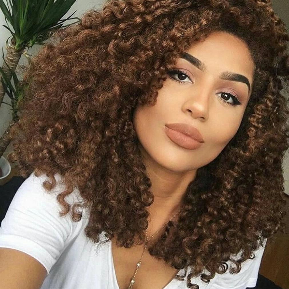 Warm brown shoulder-length curls with rounded bob-like outline
