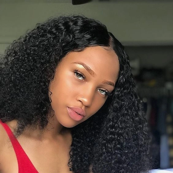 Medium black curls with deep side part and shaped edges