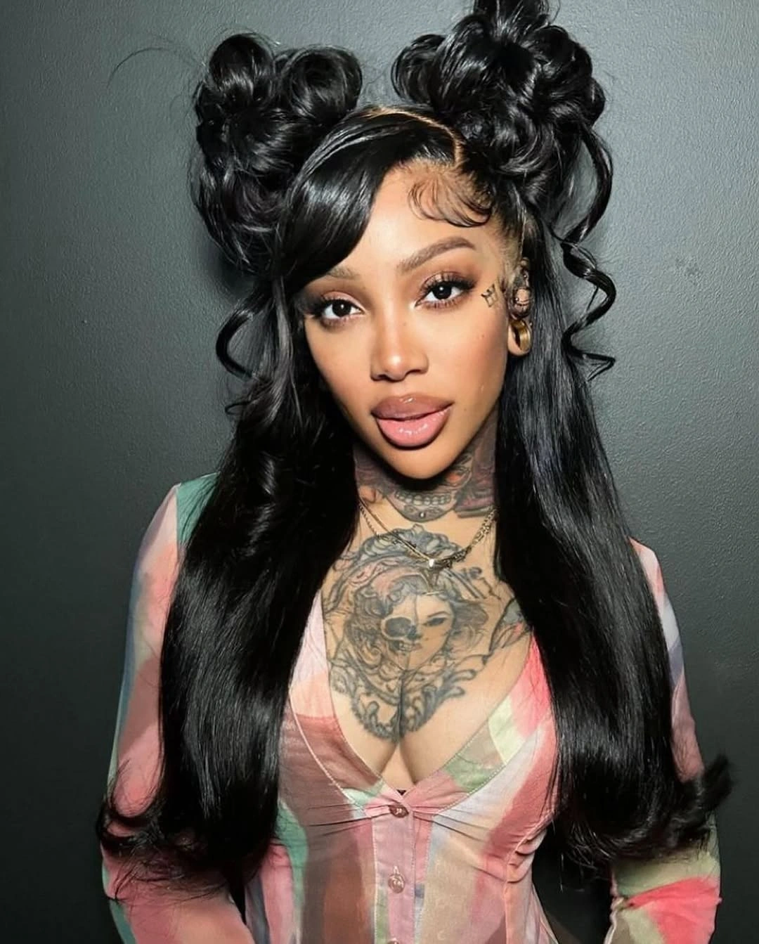 Long black hair with two high buns and curled ends