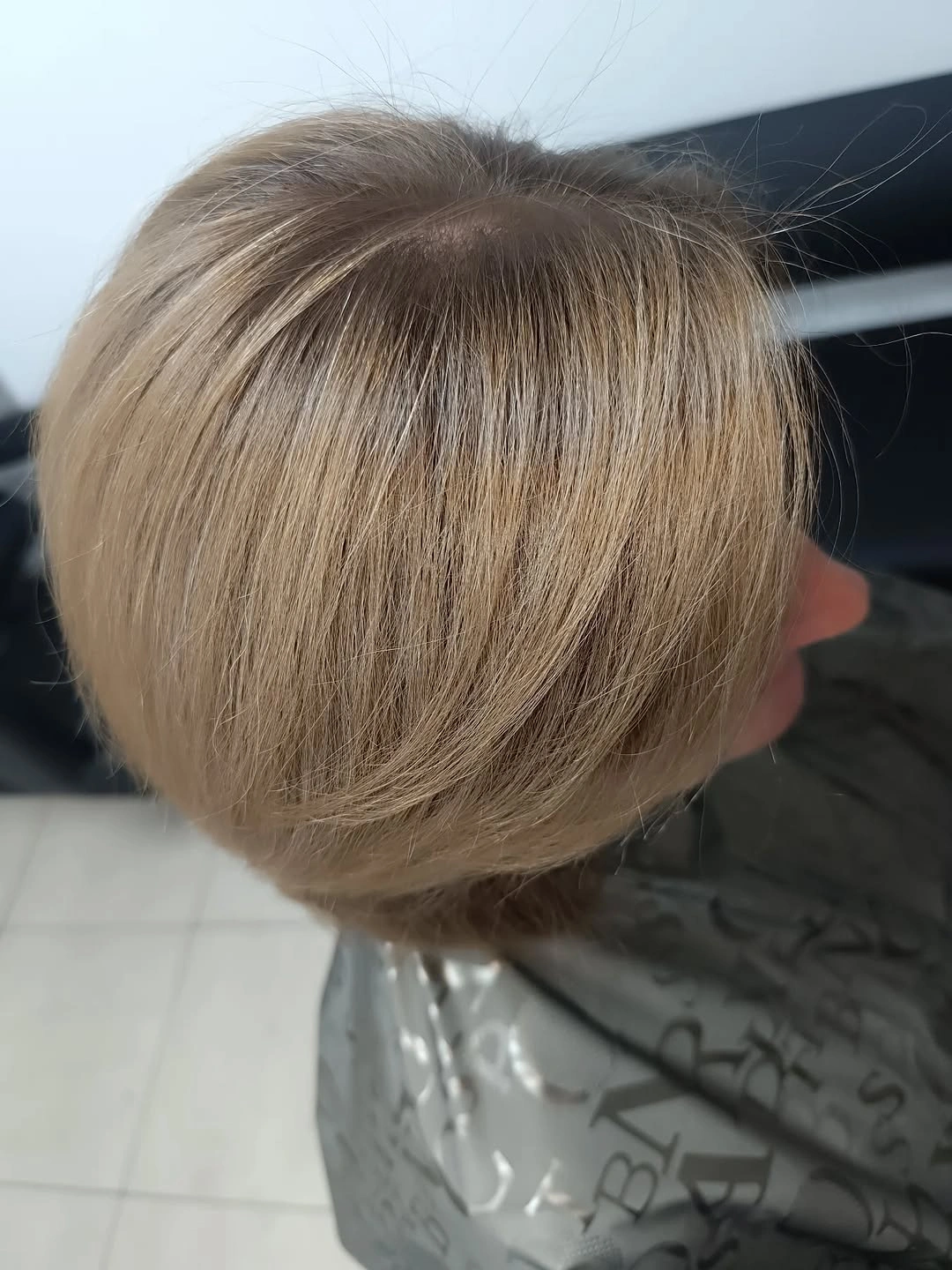Short light-brown rounded bob with smooth back shape