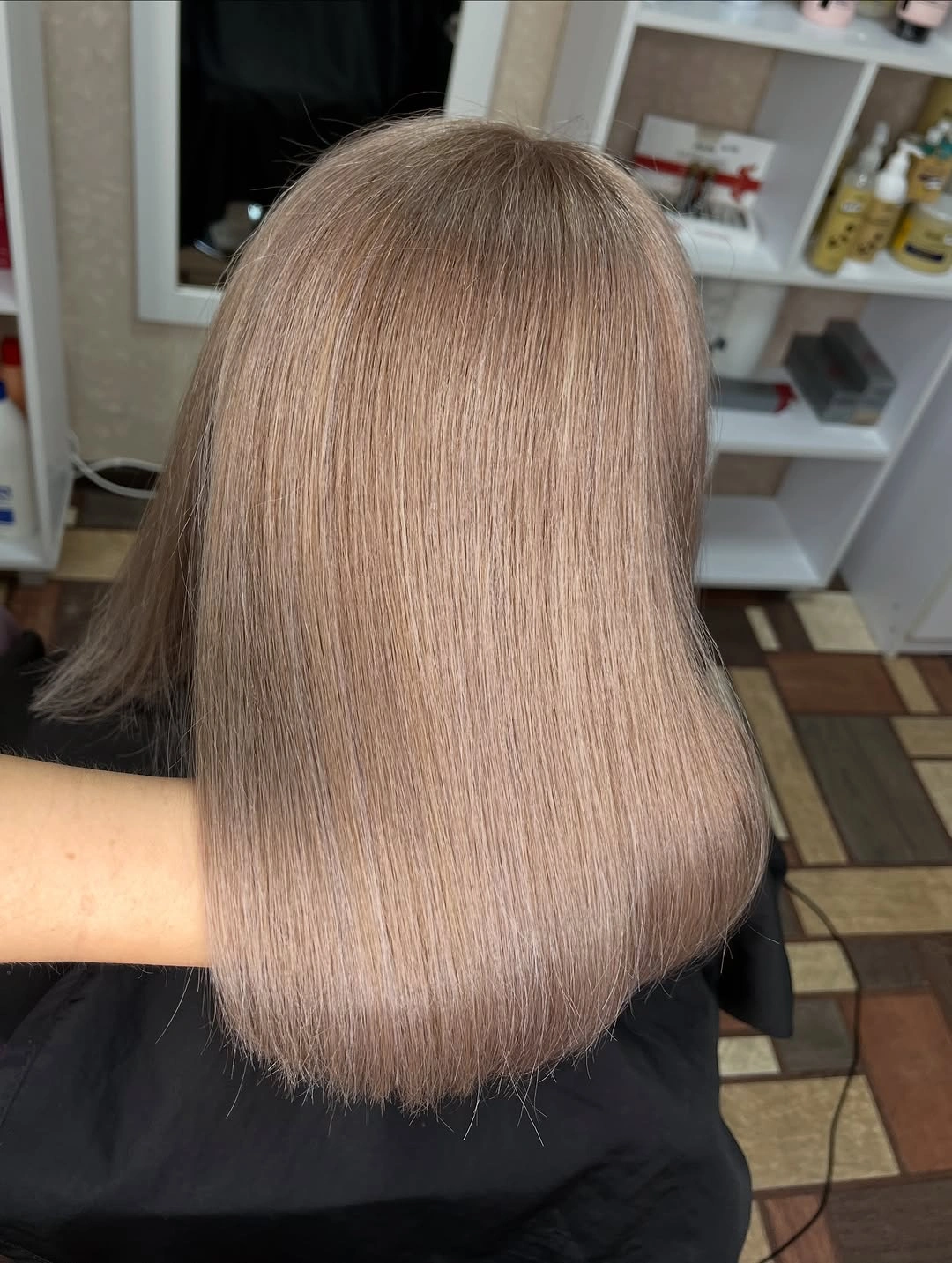 Sleek light-brown blunt bob with clean shoulder-level hem