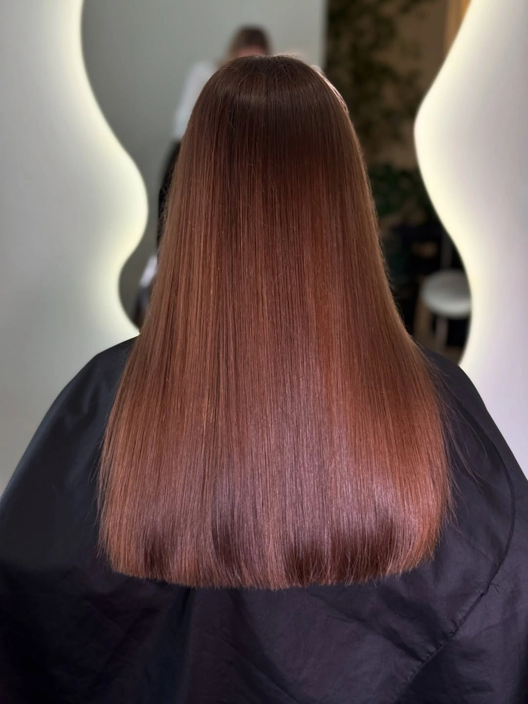 Long straight auburn hair with smooth below-shoulder ends