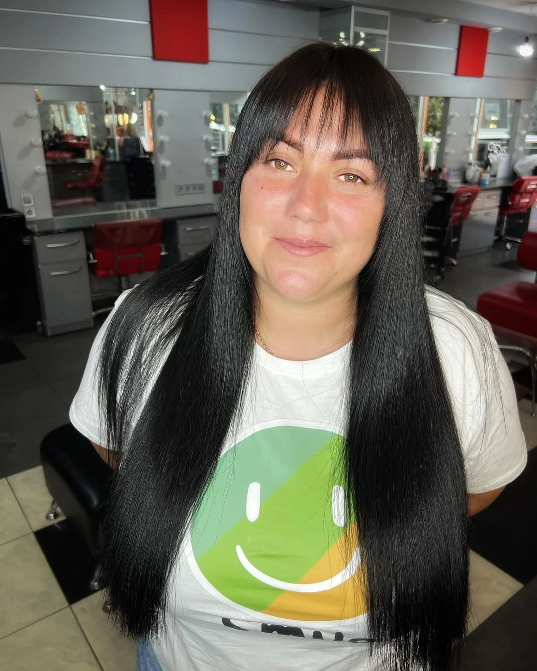 Long black straight hair with full forehead bangs