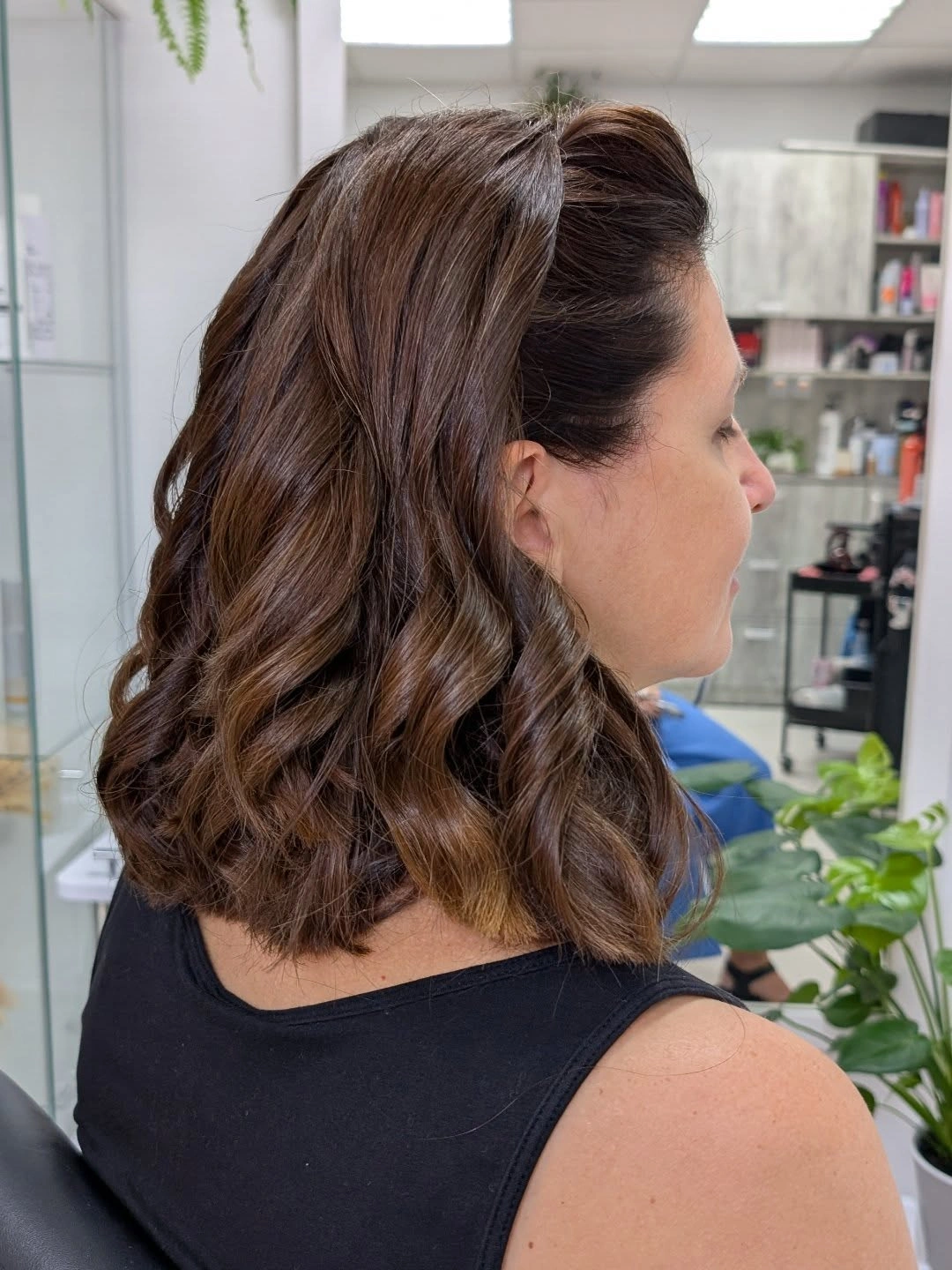 Medium dark-brown wavy hair in back-side profile