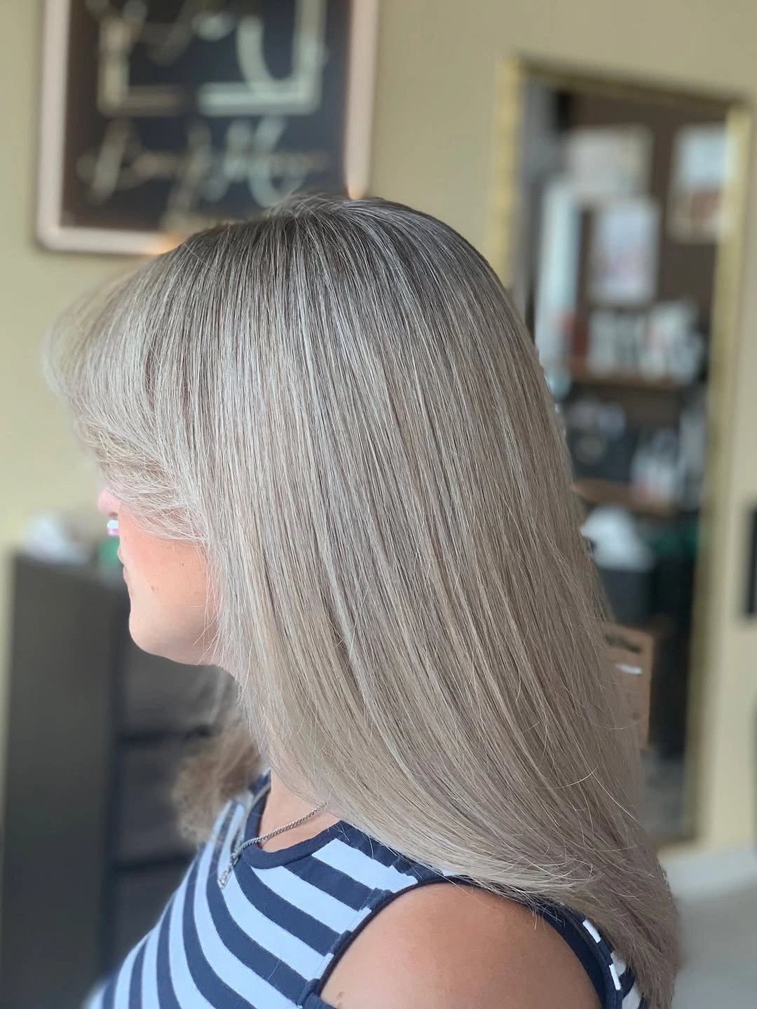 Long silver-gray hair with straight layered-looking ends