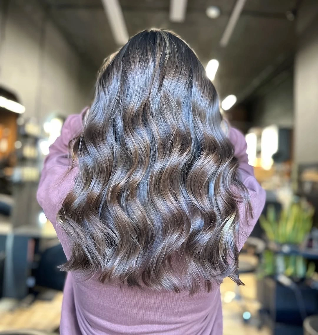 Long ash-brown gray hair with broad loose waves