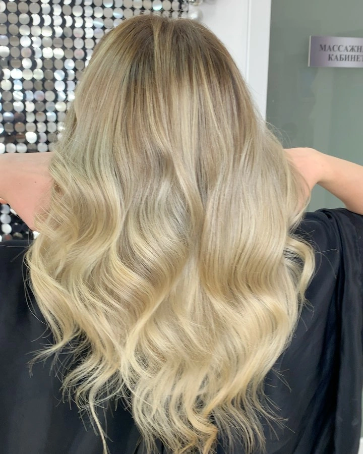 Long pale blonde hair with large soft back waves