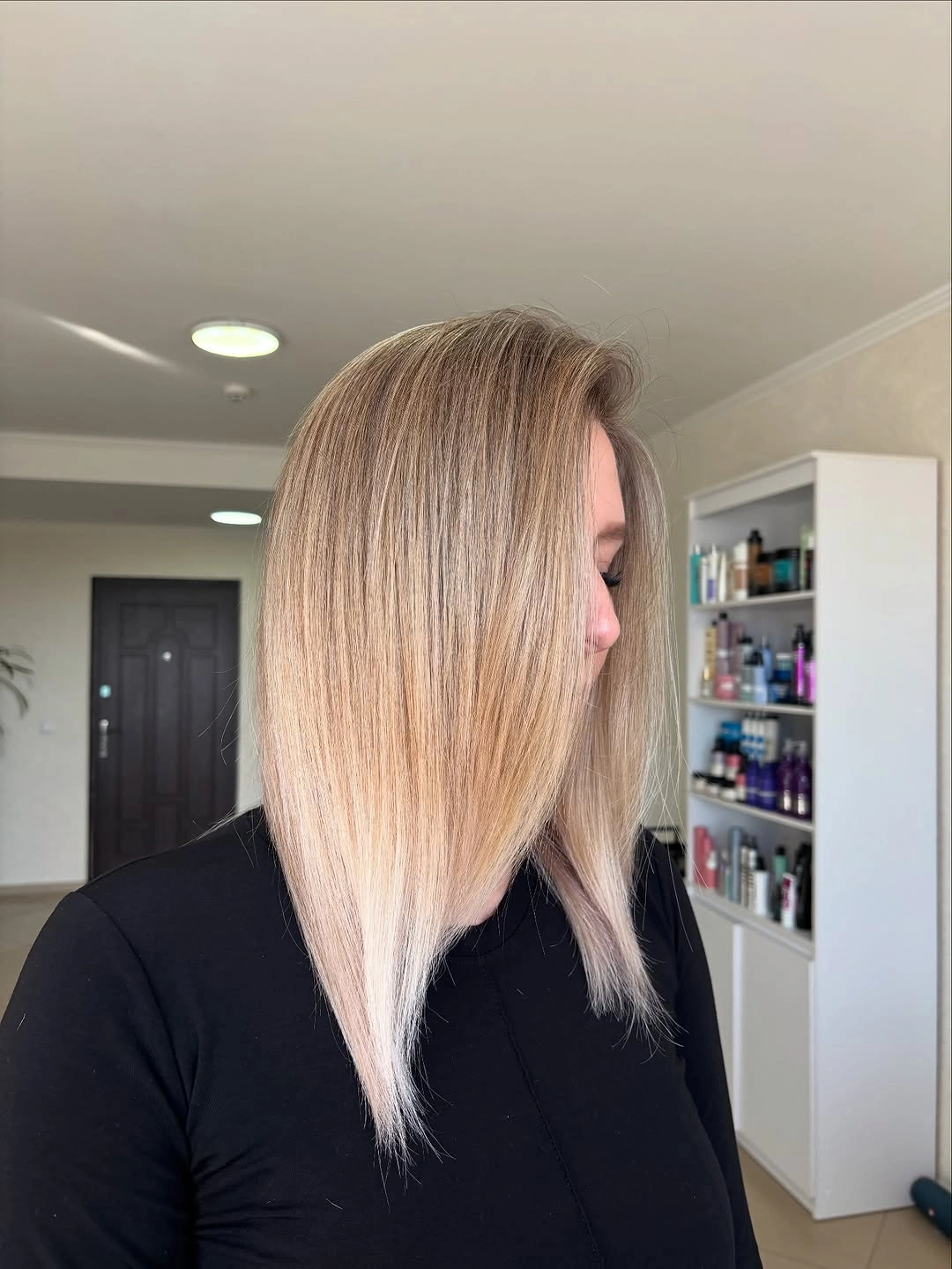 Long blonde straight hair with side part