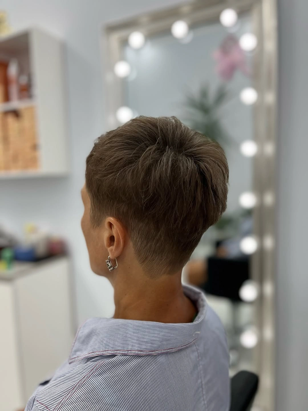 Short brown pixie haircut viewed from the back