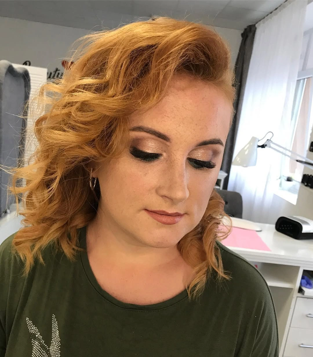 Curly orange-red bob with warm rounded shape
