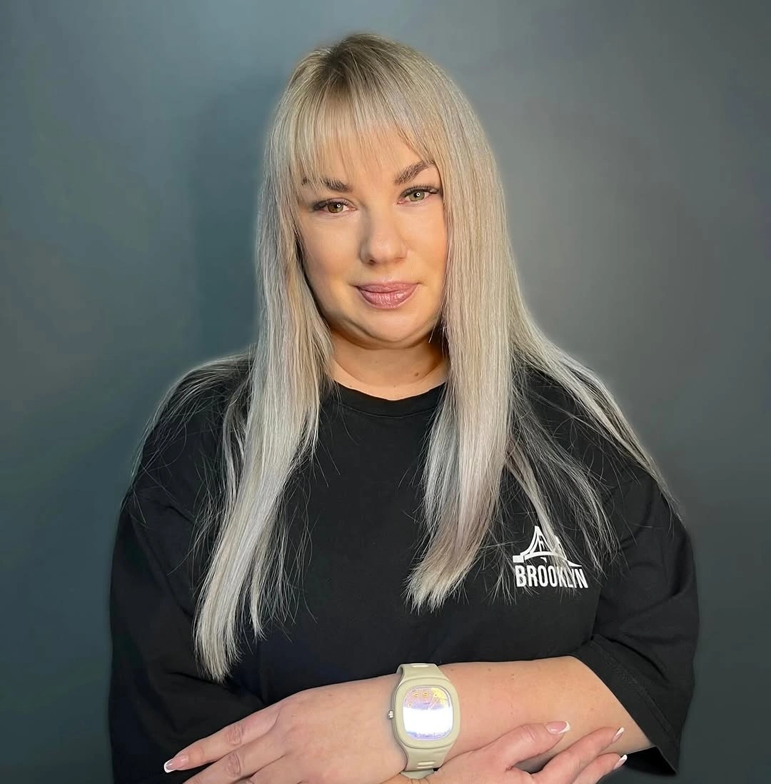 Long platinum straight hair with full bangs