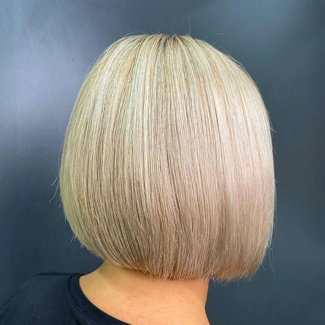 Blunt blonde bob with straight lower edge from behind