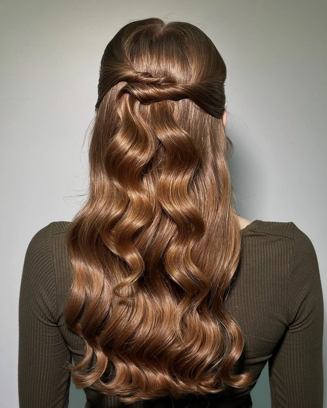 Long brown half-up hairstyle with loose waves