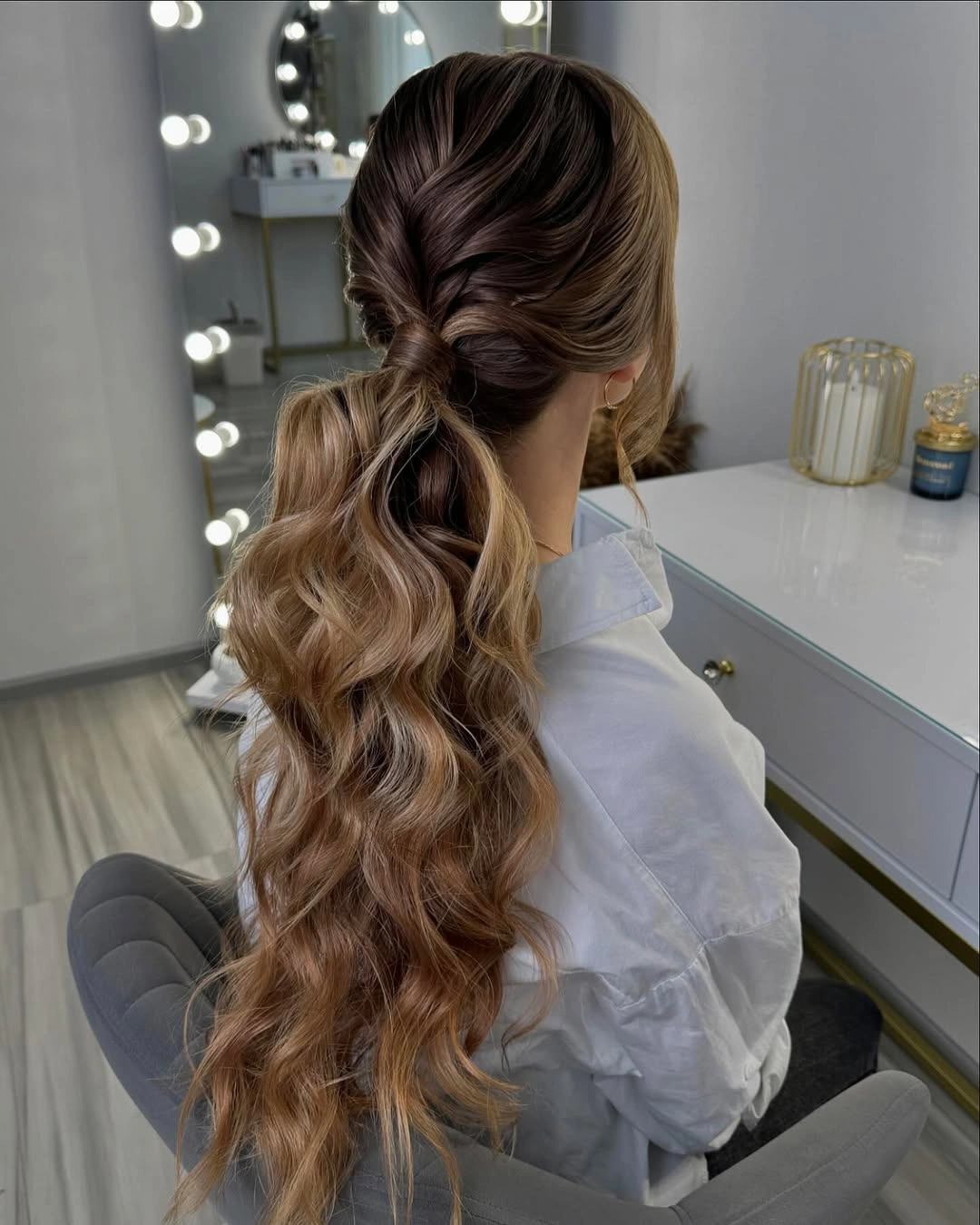 Long blonde wavy ponytail seen from back