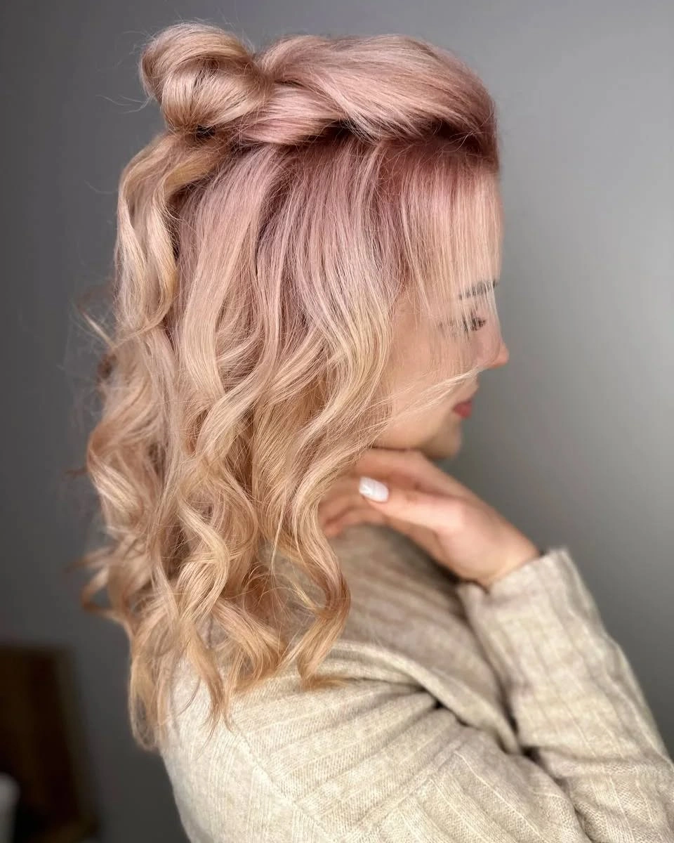 Blonde half-up wavy hair with small top knot