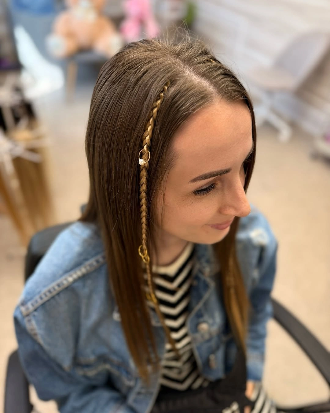 Straight brown hair with thin braided side detail