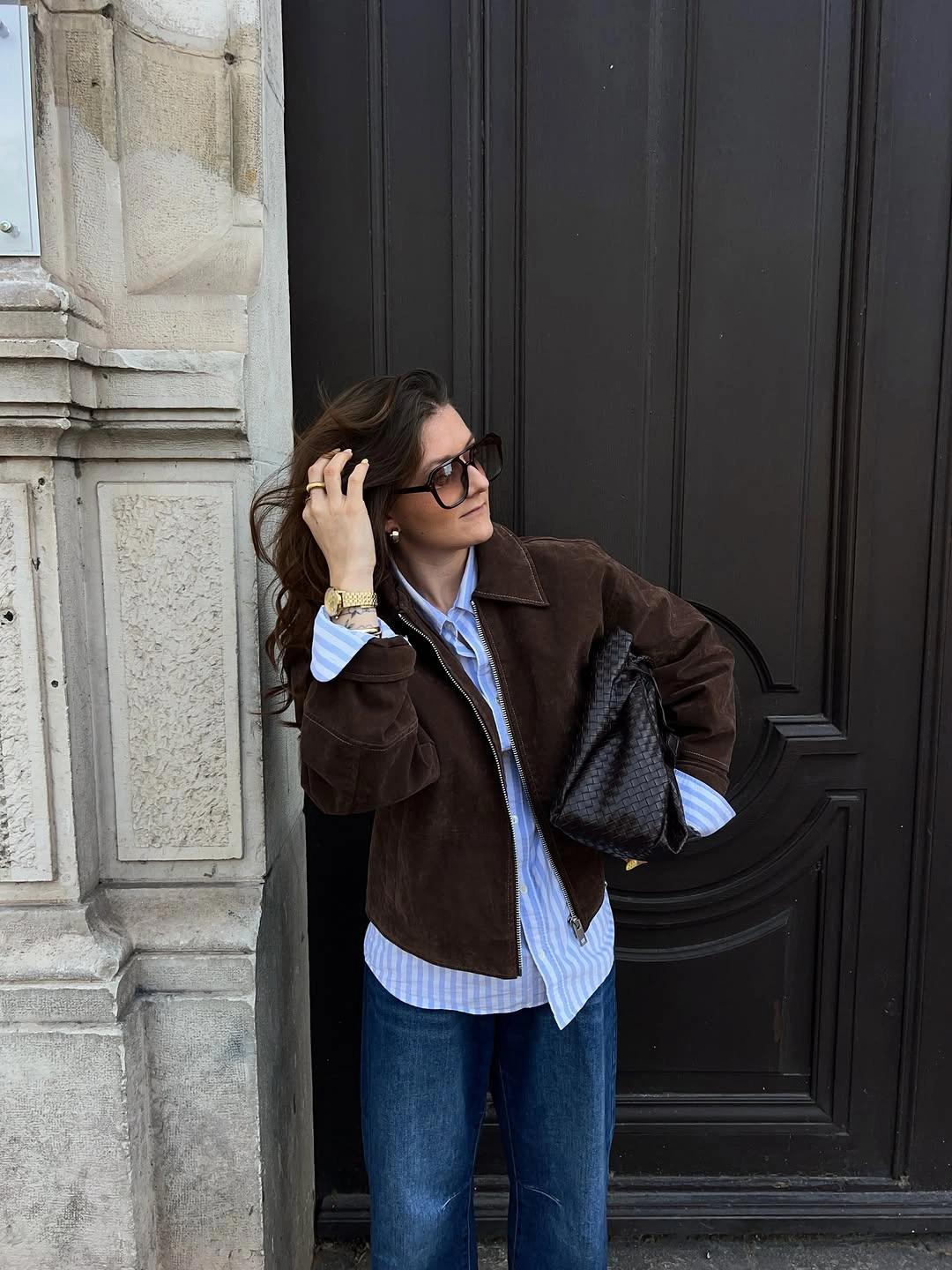 Brown cropped jacket with striped shirt and jeans