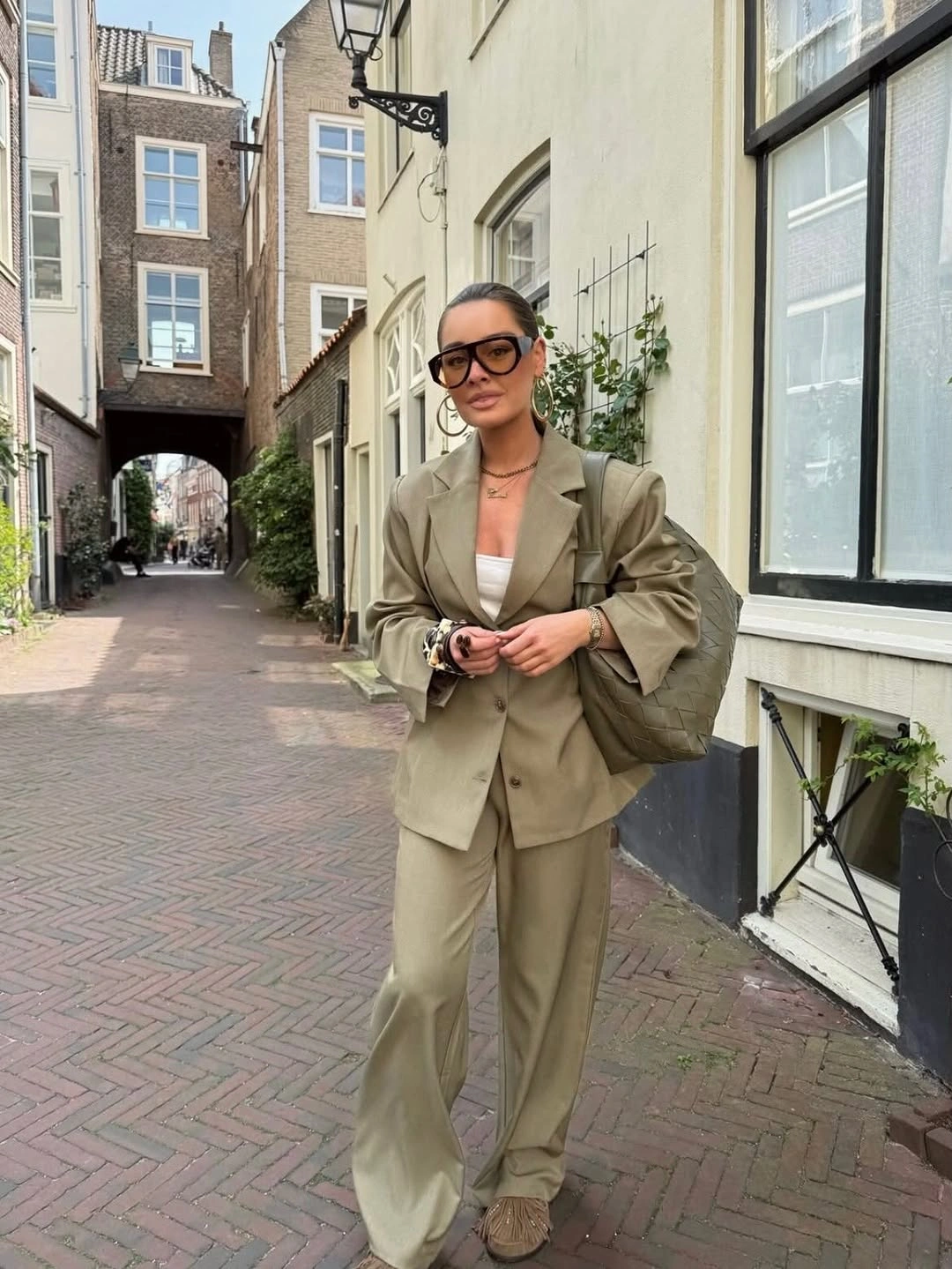 Olive beige blazer suit with wide trousers and sunglasses