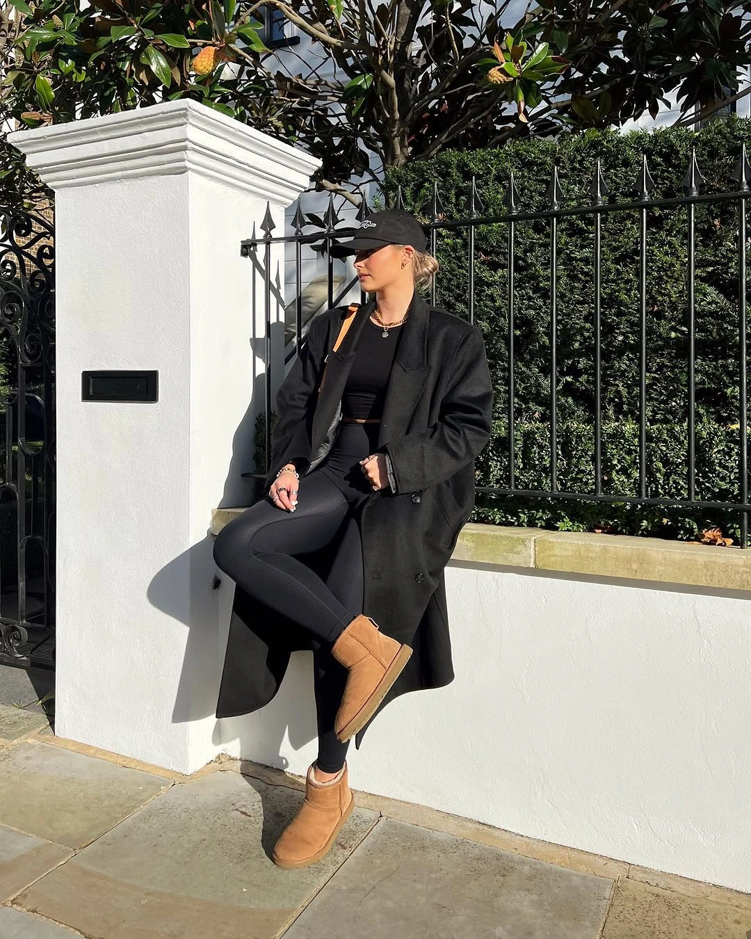 Long black coat with tan ankle boots
