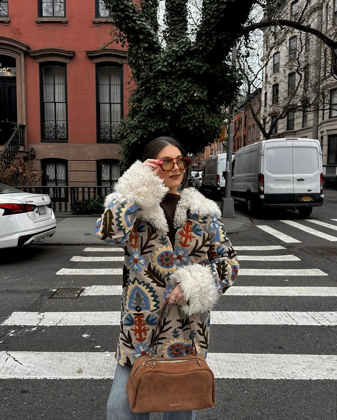 Patterned coat with fluffy white trim and denim