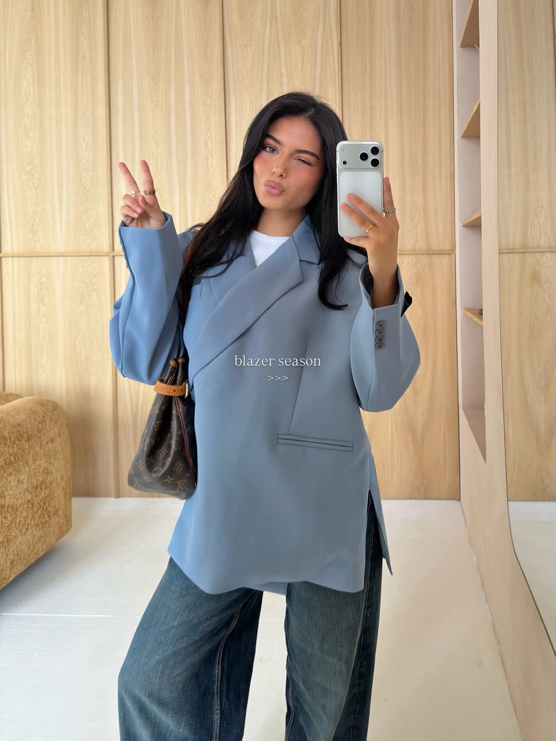 Pale blue oversized blazer with loose blue jeans